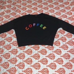 A crop top with the word Coffee on it.